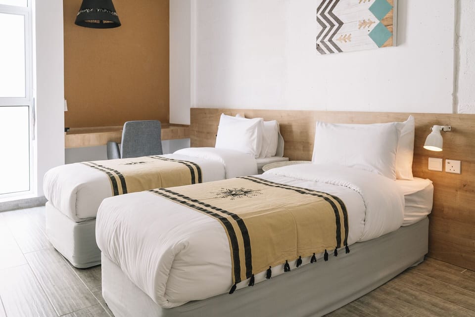 Standard Twin Room | Minibar, in-room safe, desk, soundproofing
