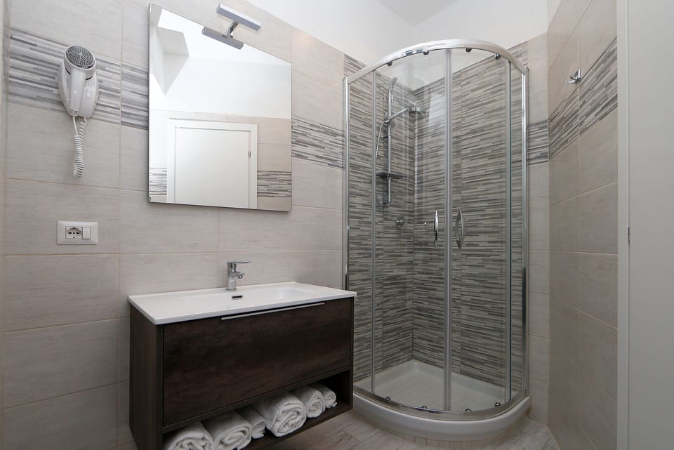 Shower, free toiletries, hair dryer, slippers