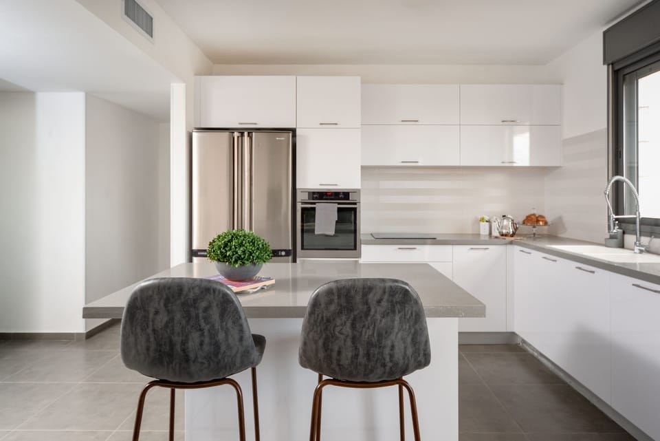 Deluxe Apartment, 3 Bedrooms | Private kitchen | Full-size fridge, oven, stovetop, cookware/dishes/utensils