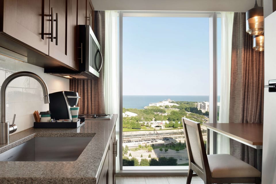 Suite, 1 Bedroom, Corner | Private kitchen | Full-size fridge, microwave, stovetop, dishwasher