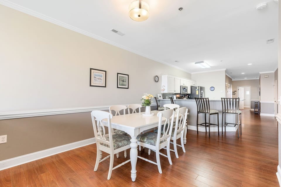 Kitchen and dining area with bar seating