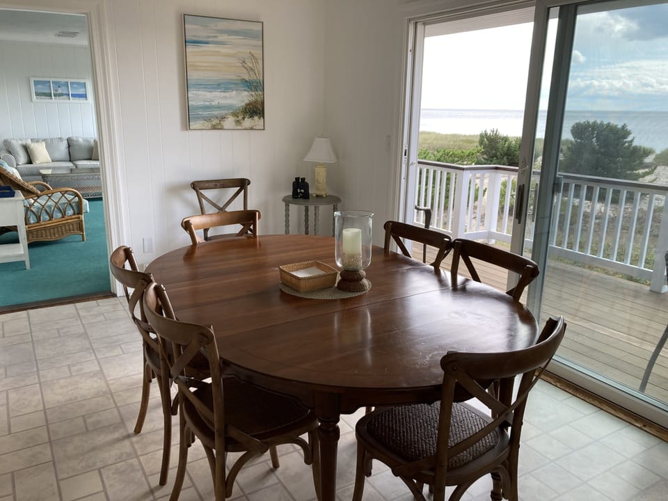 Open dining to deck with beautiful views from a spacious kitchen!