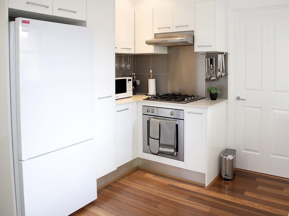 A fully equipped kitchen with full fridge and freezer and microwave