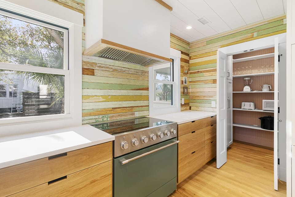 The centerpiece of the remodeled, fully furnished kitchen is a green induction oven.