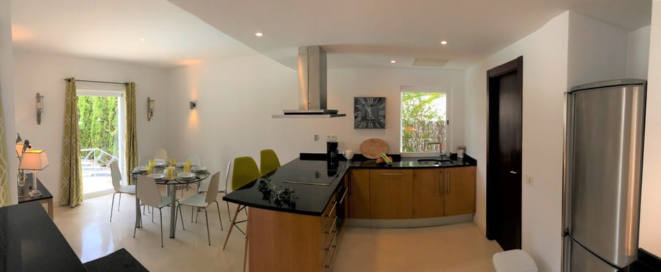 Open Plan modern design Kitchen with dining area and breakfast bar.