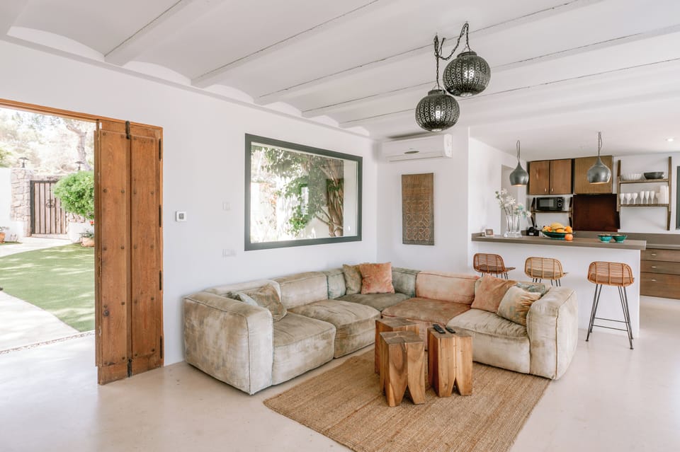 Sofa and breakfast bar behind, door to garden