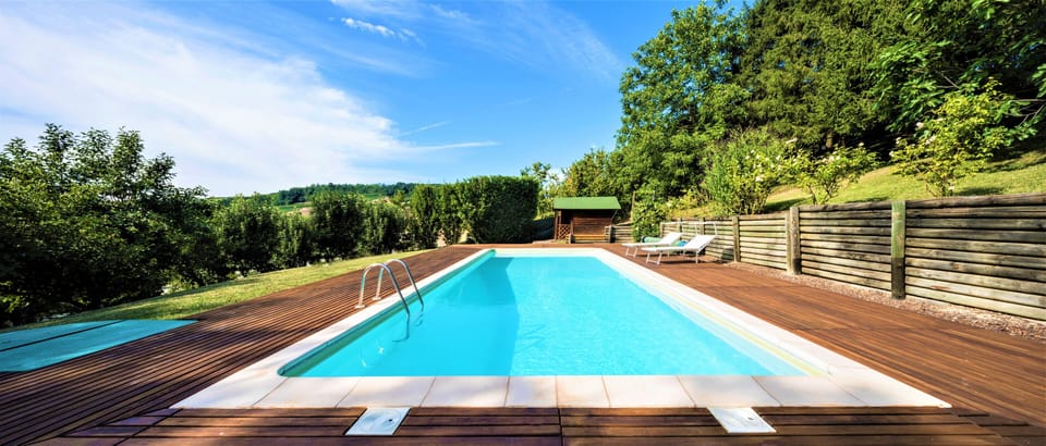Private pool surrounded by teak wood area