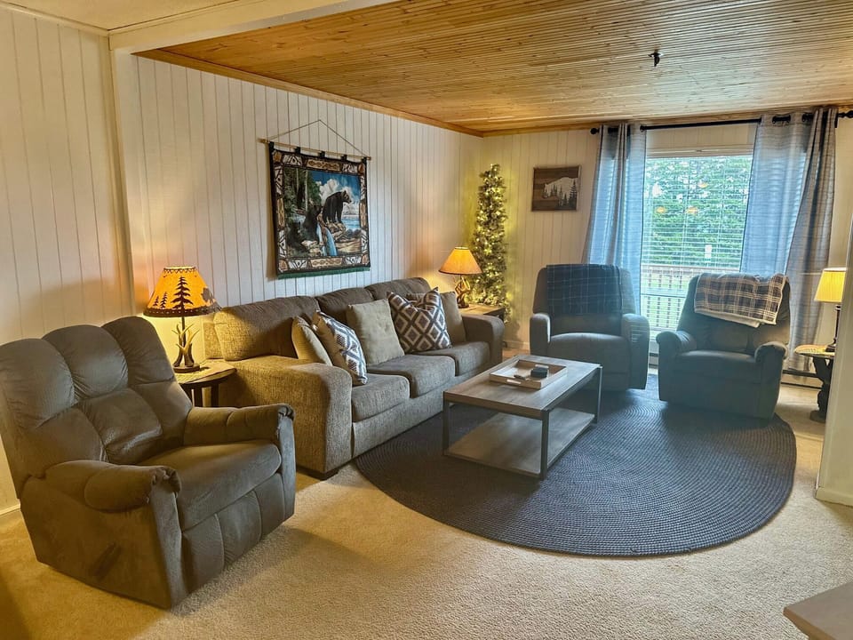 Living Room with queen size sleeper sofa and 3 rocker recliners