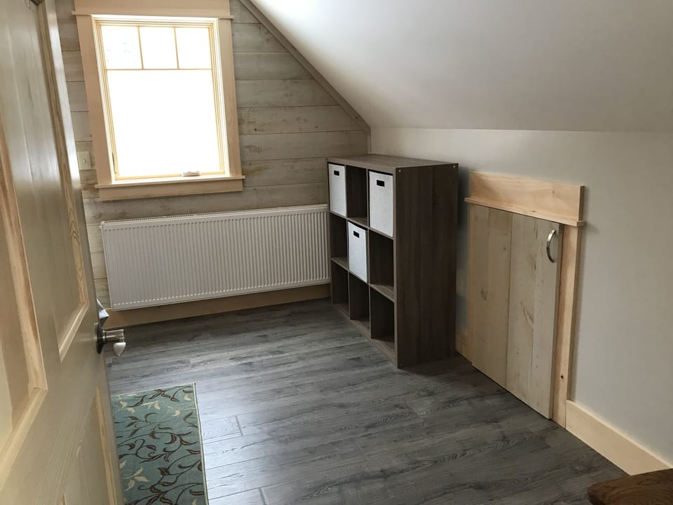 Storage: Shelving unit with baskets and kneewall closet