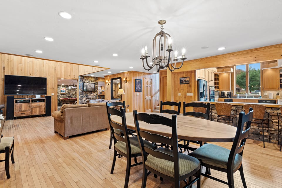 The dining room table sits 8 people. There's a nearby breakfast bar for 4 guests
