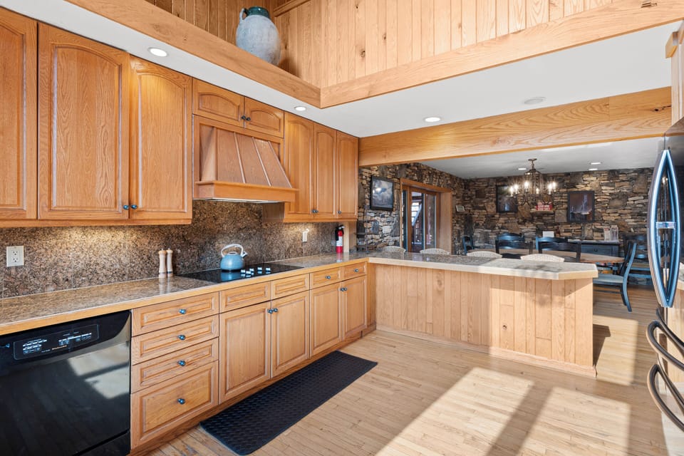 The kitchen is fully stocked with utensils, cook ware, and 2 coffee makers.