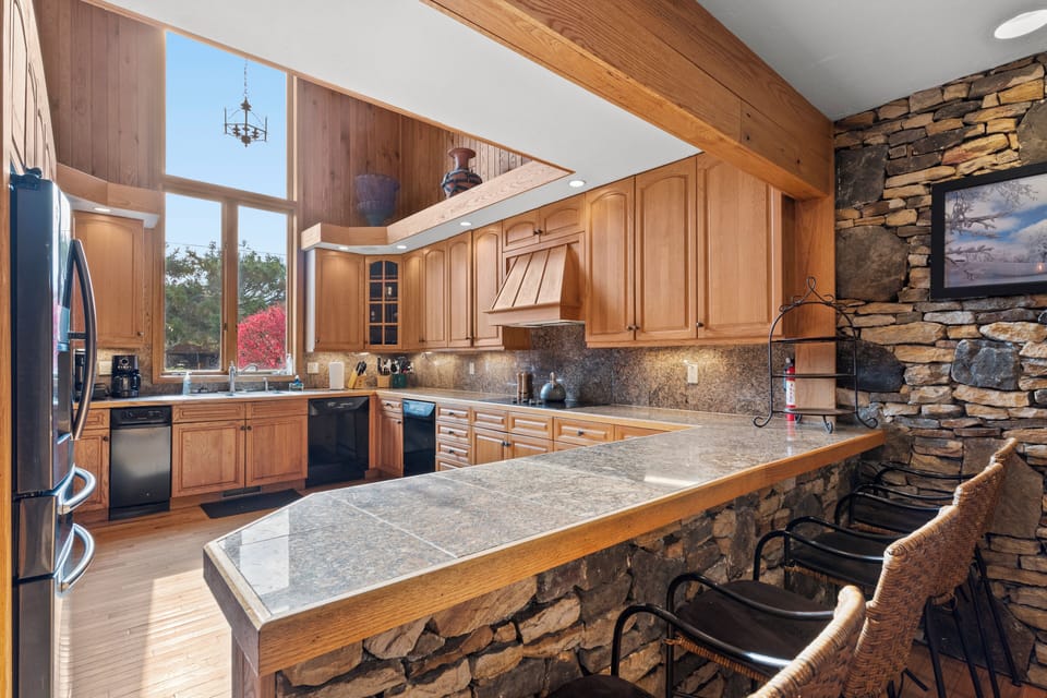The gigantic windows in the kitchen give off tons of natural lighting.