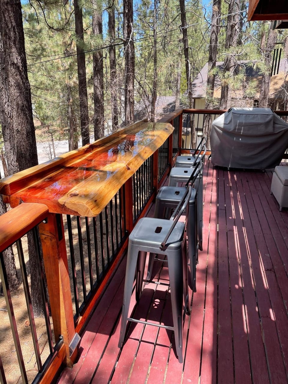 Live edge bar top on second floor deck