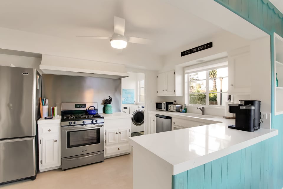 Enjoy the kitchen with quartz countertops and full size washer/dryer!