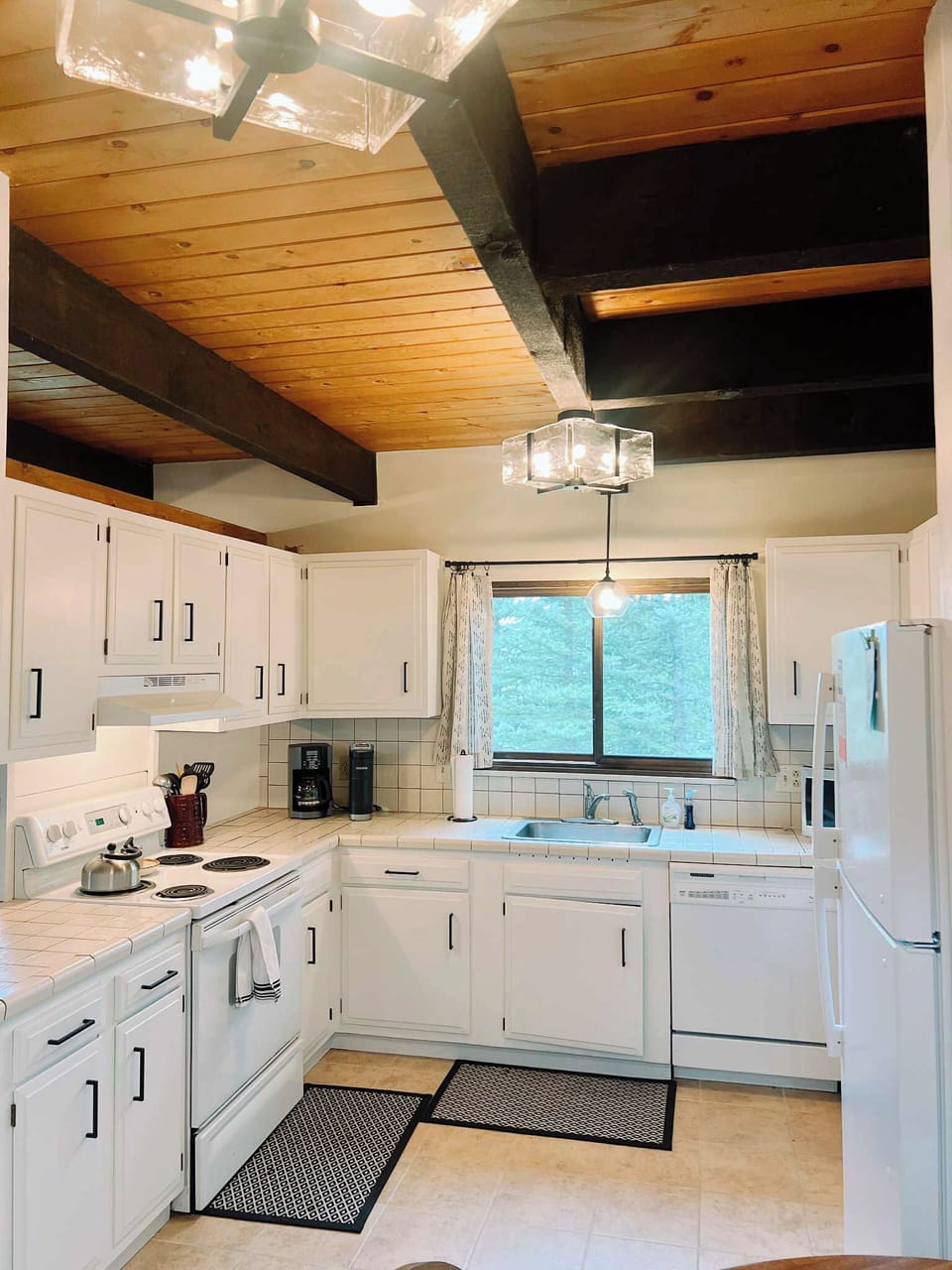 Roomy kitchen includes coffee maker, Keurig, microwave, oven, toast & more.