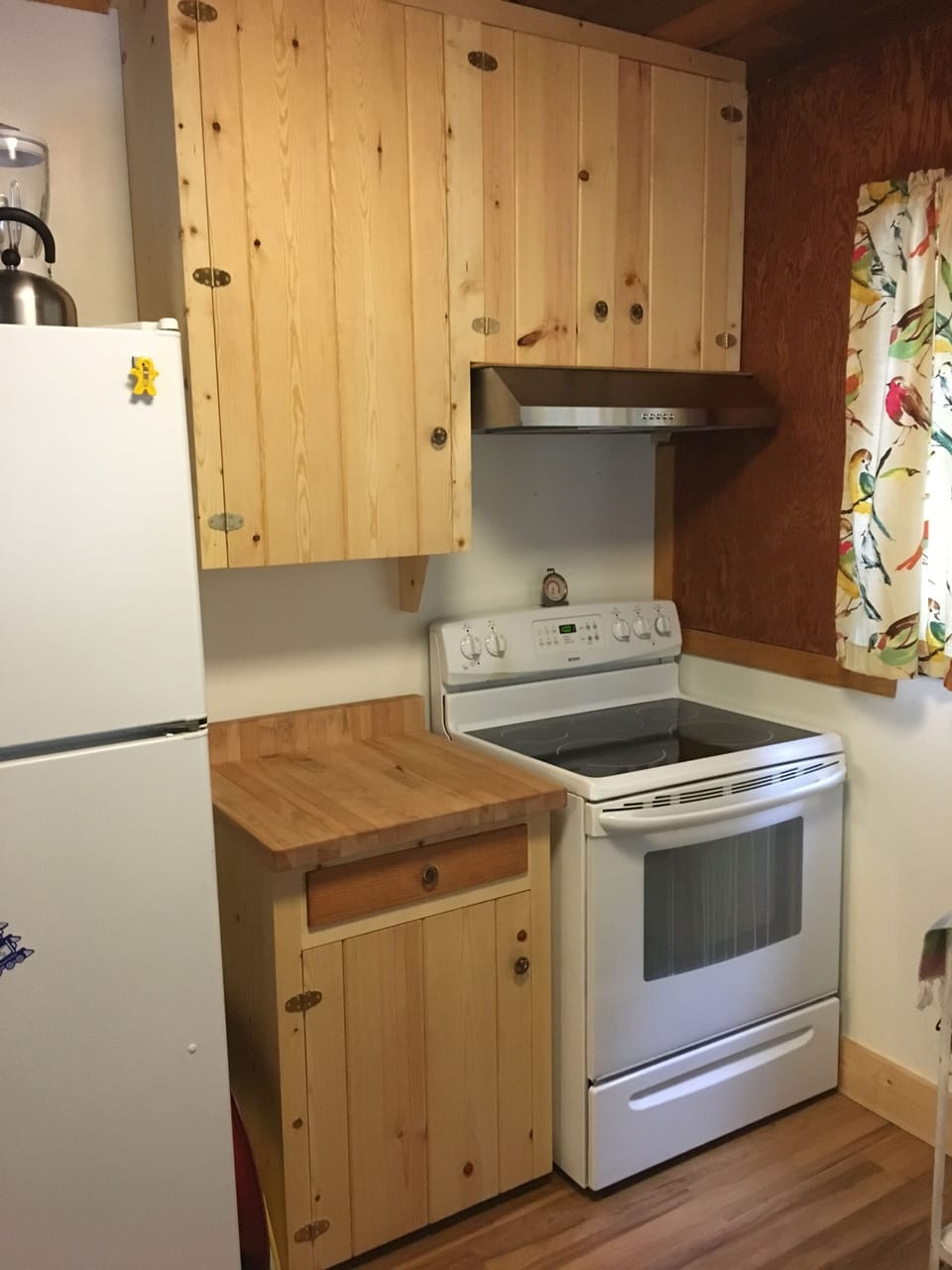 New butcher block prep counter, cabinets and range hood 