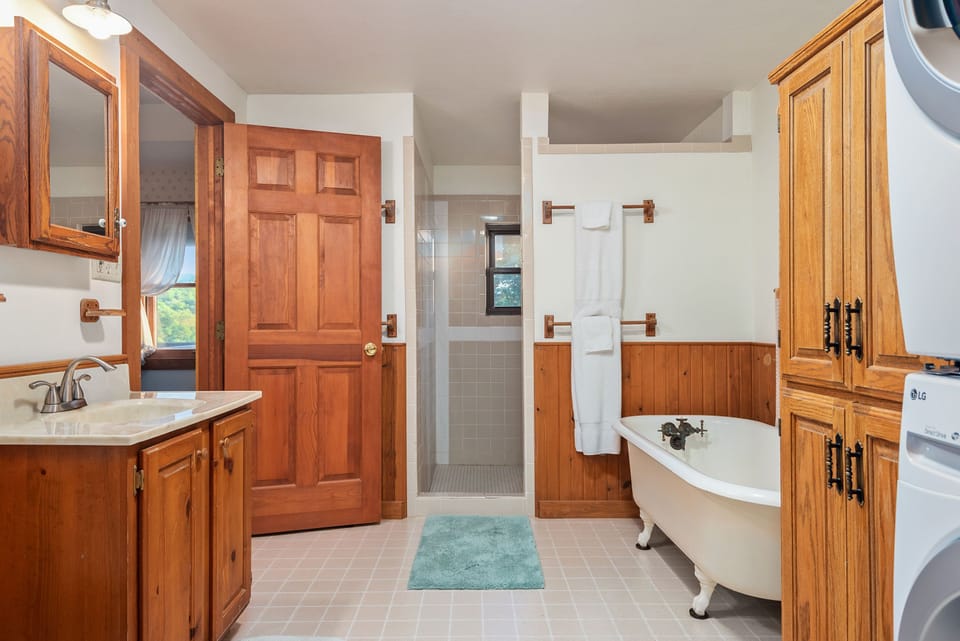 Master bathroom with walk in shower and two showerheads.