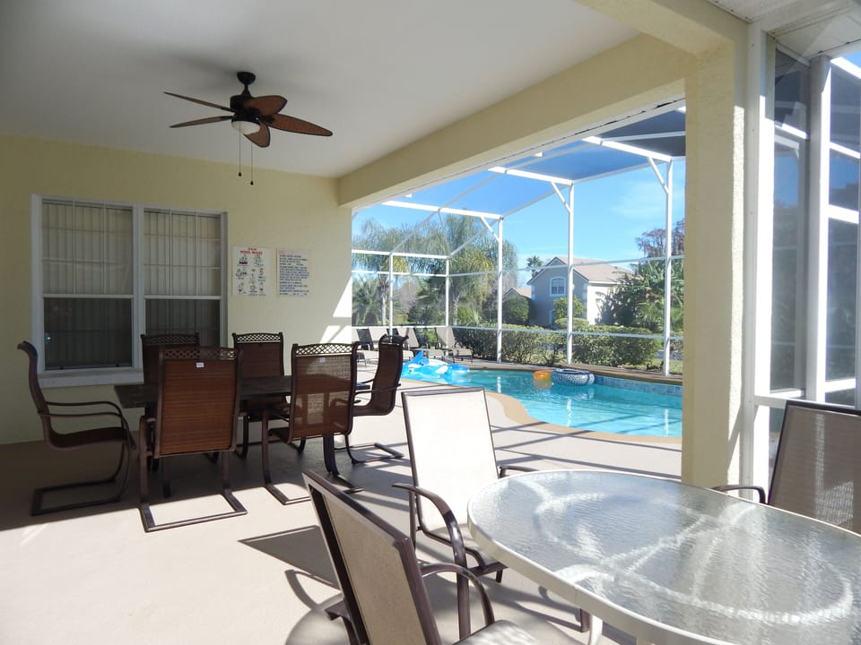 Spacious, screened in lanai area with Sunbrella dining set