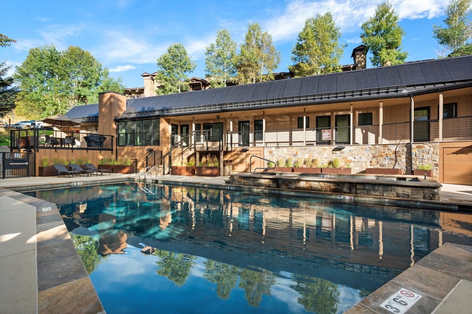 Enjoy the serenity of the pool area of the resort-like condo complex