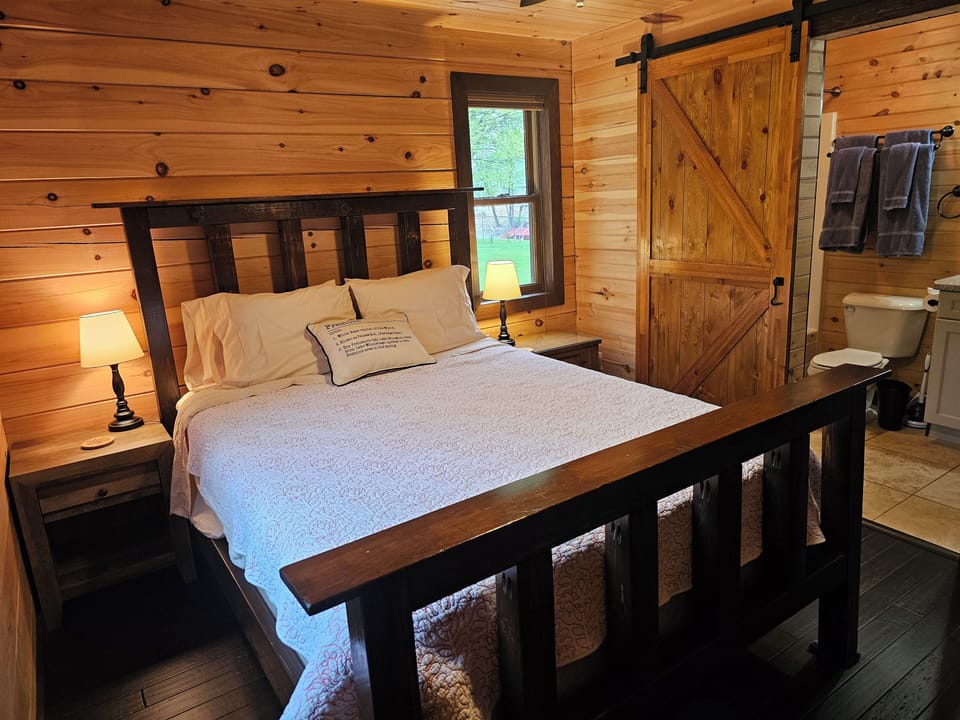 Queen Bed with access to main floor bath room