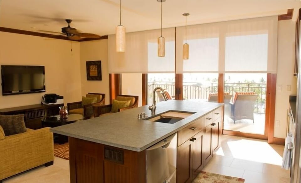 Living room / kitchen with automatic light-filtering shades half down
