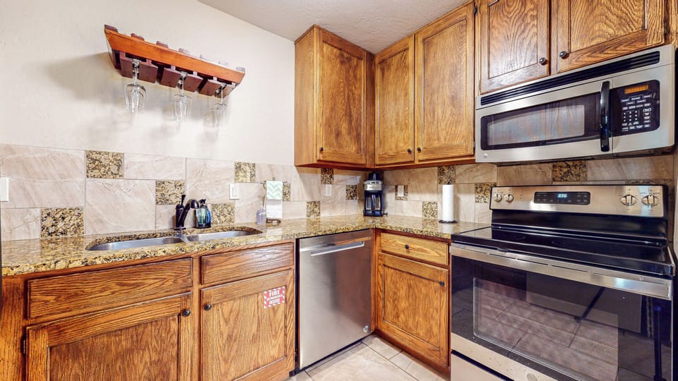 Fully equipped with dishwasher, oven, stove, microwave, and refrigerator