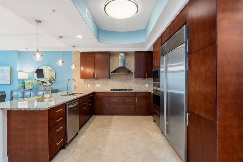 Spacious kitchen, stocked with dinnerware and cooking tools