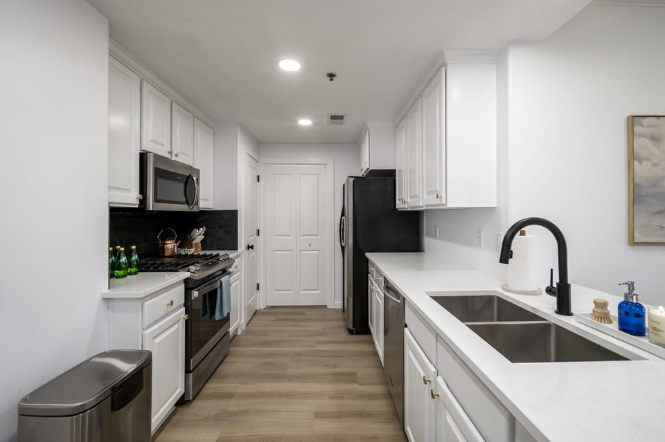 Beautifully redesigned kitchen that comes equipped with cooking utinsels