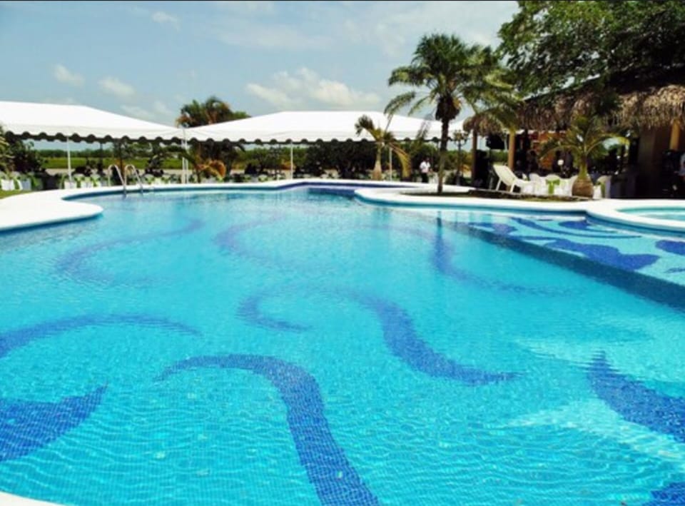 Outdoor pool, open 8:00 AM to 9:00 PM, pool umbrellas, sun loungers