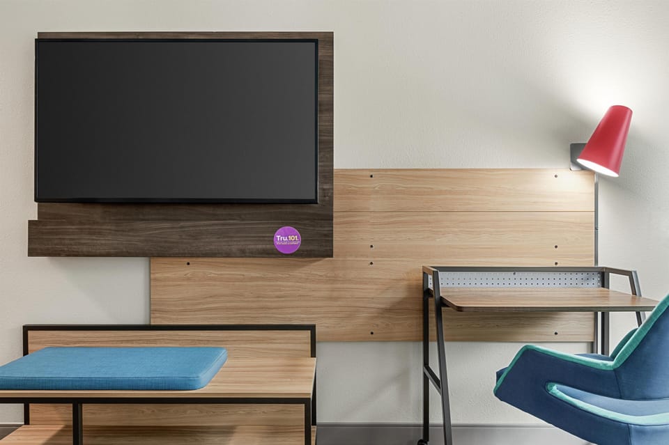 Premium bedding, desk, laptop workspace, blackout drapes