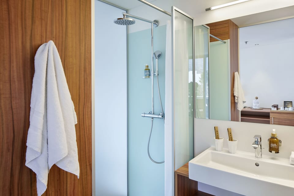 Shower, eco-friendly toiletries, hair dryer, bathrobes