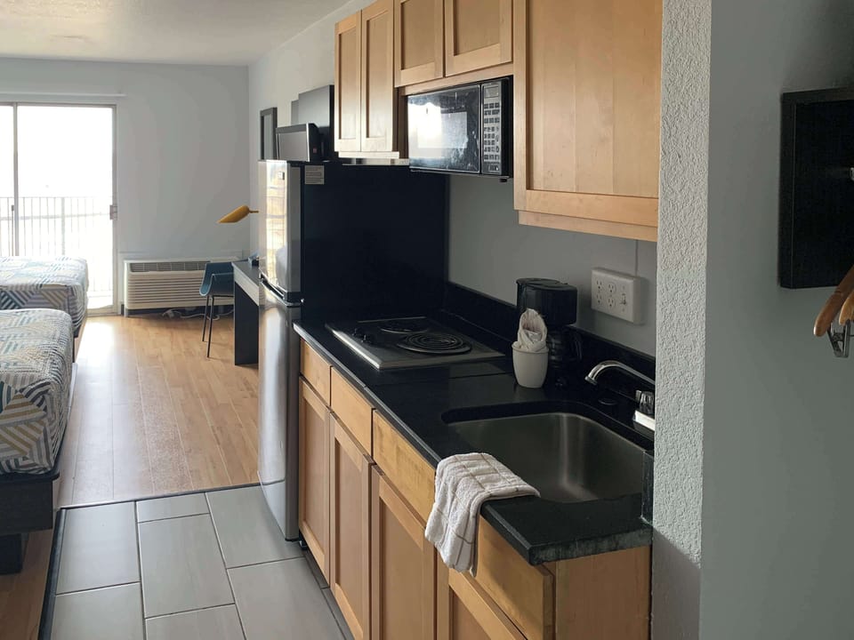 Deluxe Room, 2 Double Beds, Non Smoking, Kitchenette | Desk, laptop workspace, blackout drapes, iron/ironing board