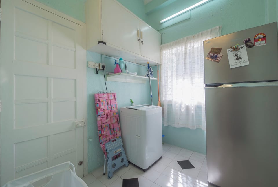 Washroom, comes with iron, ironing board & washing machine.