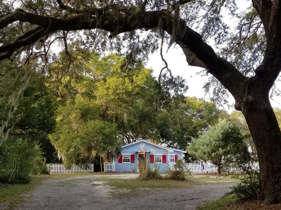 Nestled under mossy oaks about half way down Ft Morgan Rd Private but convenient
