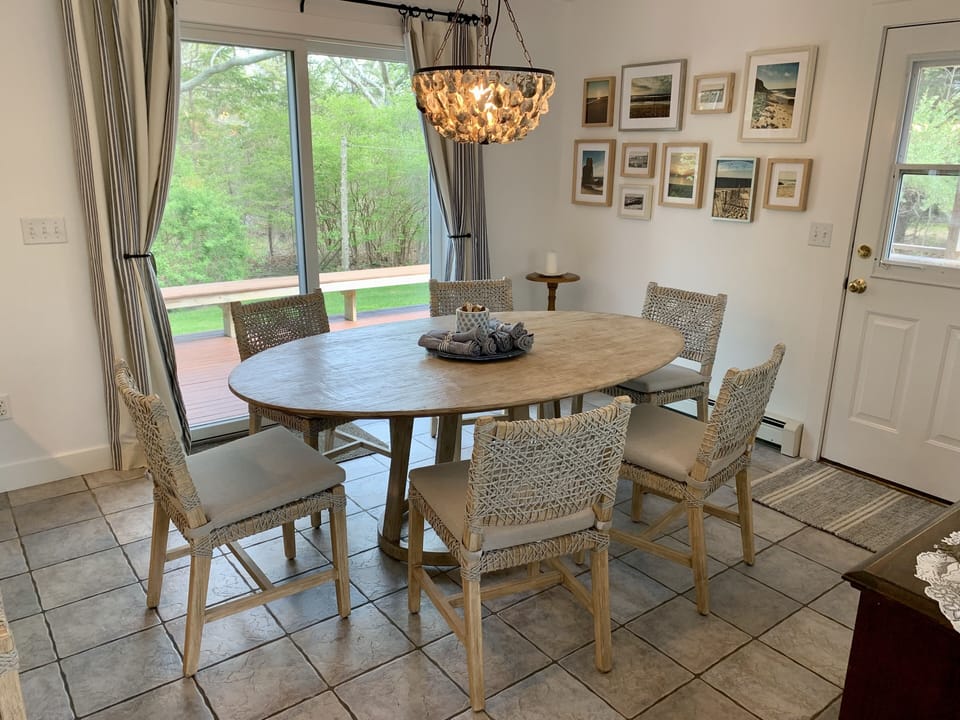 Kitchen opens to dining area, screened-in porch and deck for easy entertaining