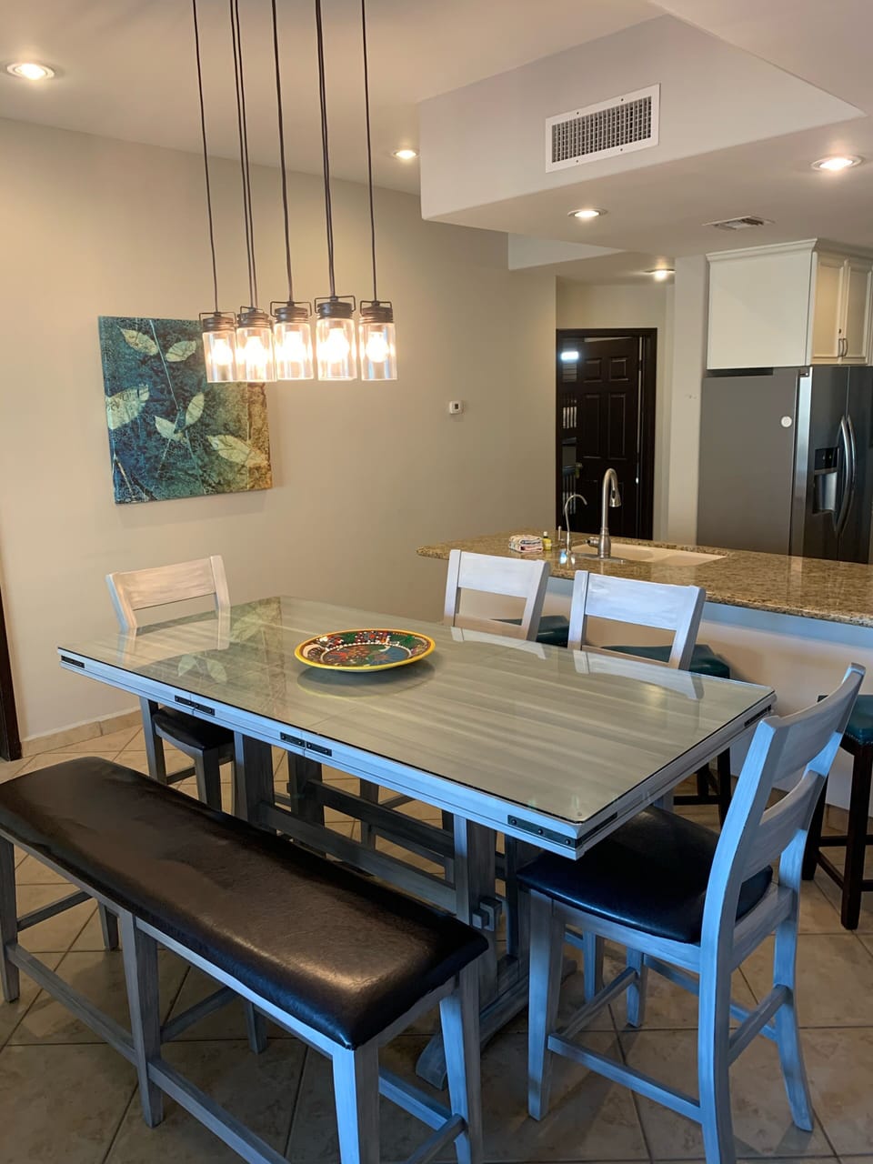 Table Sits 7 + 3 addtl barstools in counter