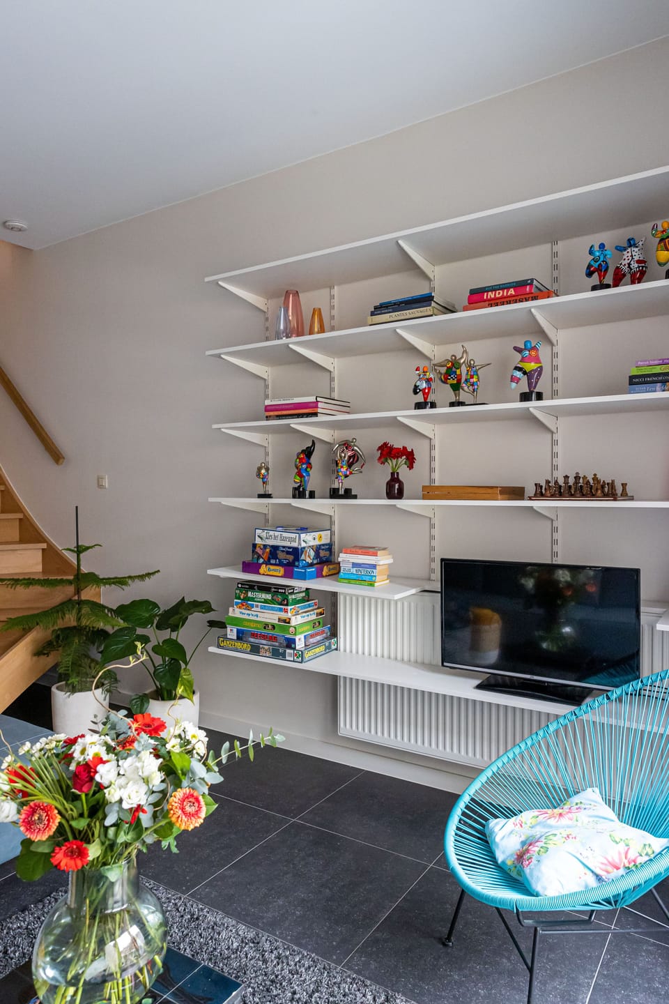 living room with lots of funny big mammas .
found the games?