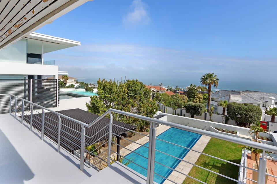 View from the front balconies of the new pool, patios and garden and the sea 