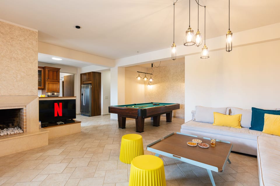 The playroom features a 50" HDTV,  PS4, as well as a fireplace.