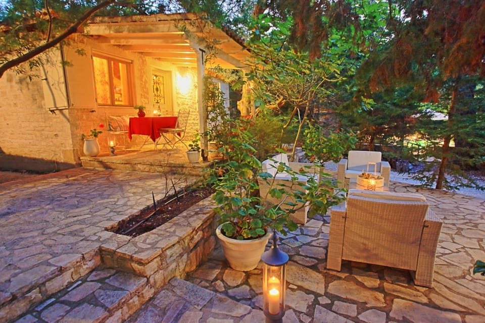 Sun loungers and pool at night