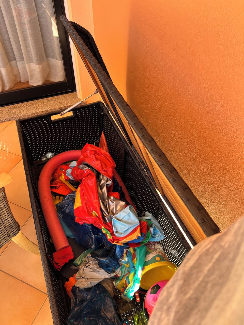 Box of pool and beach toys