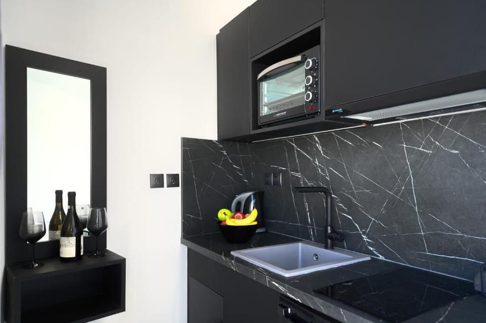 Junior Suite | Private kitchen | Full-size fridge, microwave, stovetop, coffee/tea maker