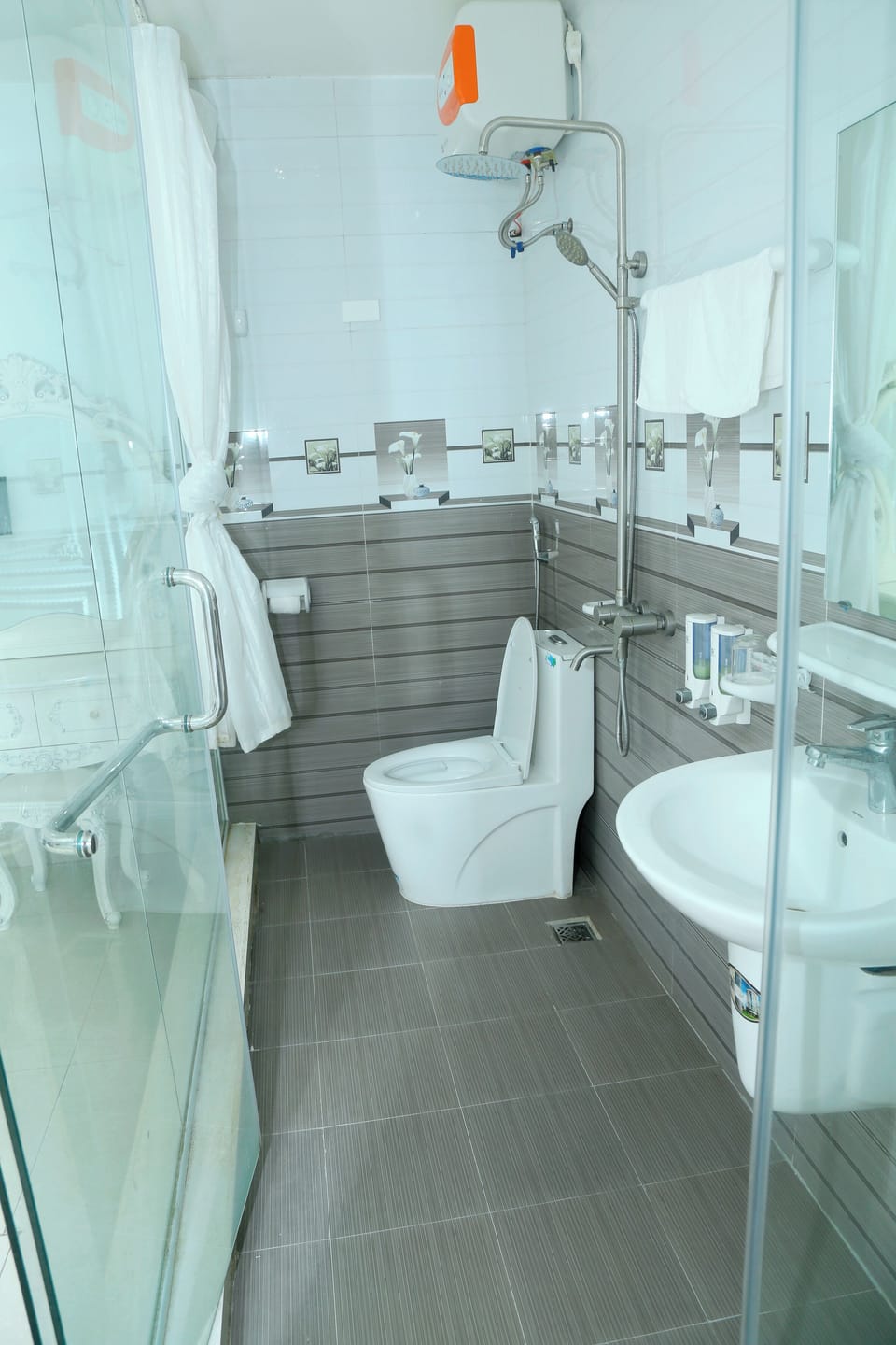 Shower, free toiletries, hair dryer, slippers