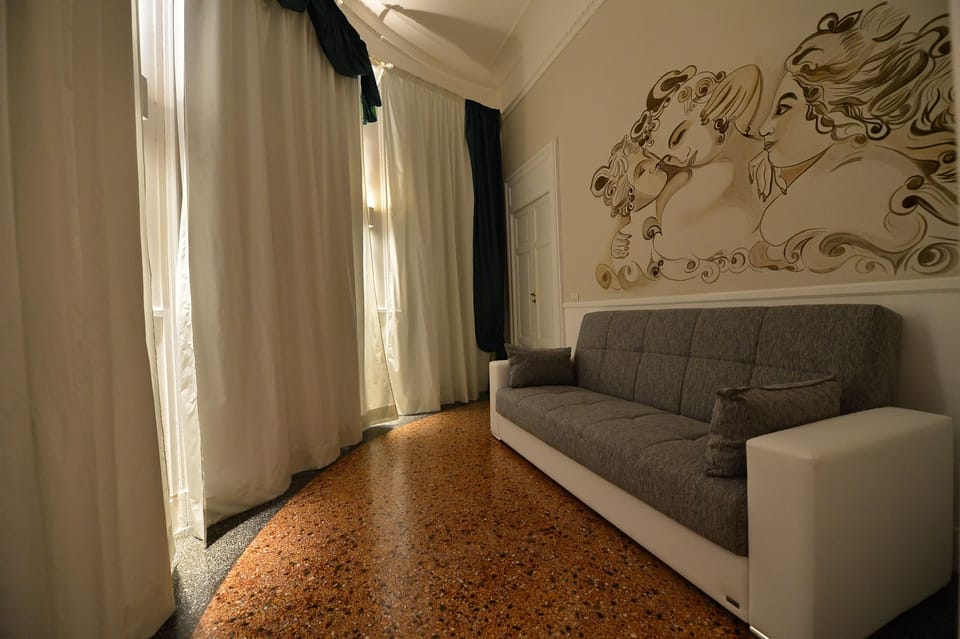Superior Quadruple Room | Living room | Flat-screen TV