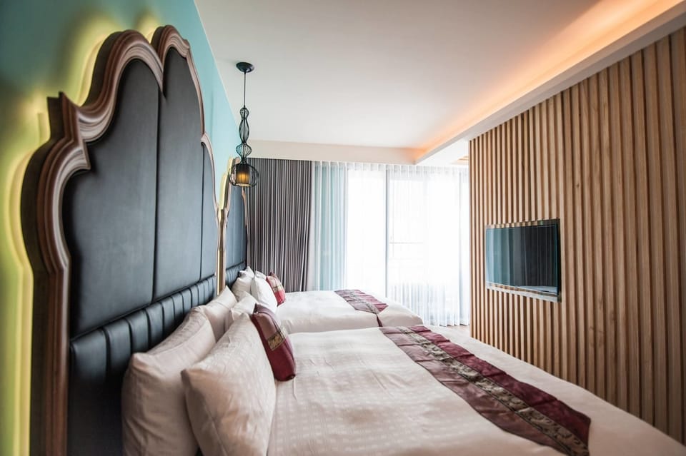 Deluxe Quadruple Room, 2 Queen Beds, Ocean View | Desk, soundproofing, free WiFi, bed sheets