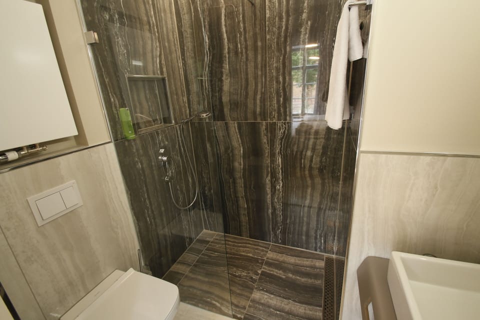 Shower, bathrobes, slippers, towels
