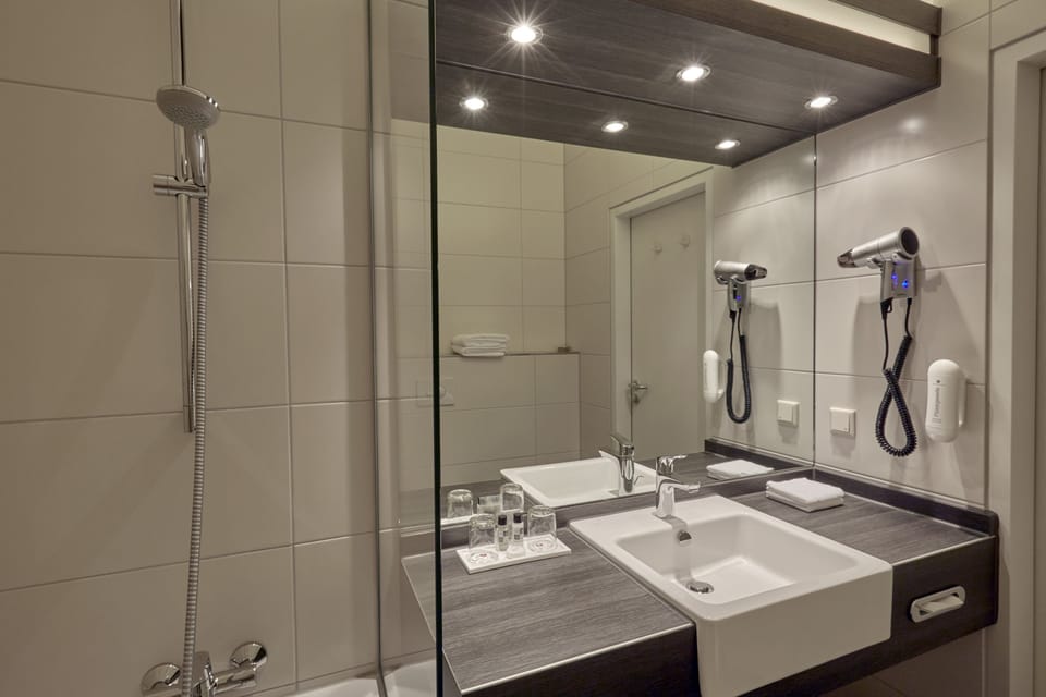 Eco-friendly toiletries, hair dryer, bathrobes, towels