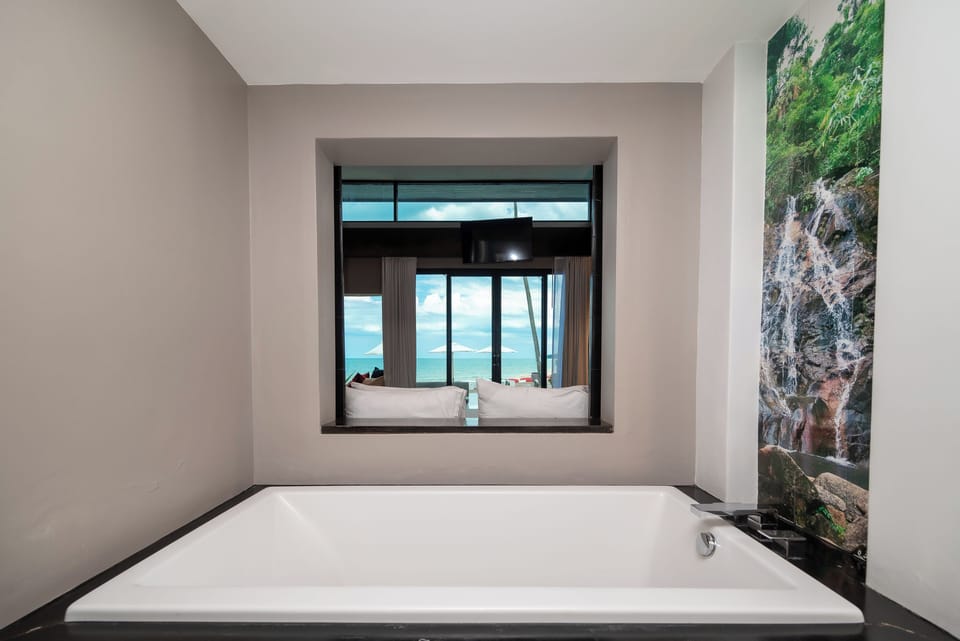 Poolside Villa | Bathroom | Separate tub and shower, rainfall showerhead, free toiletries