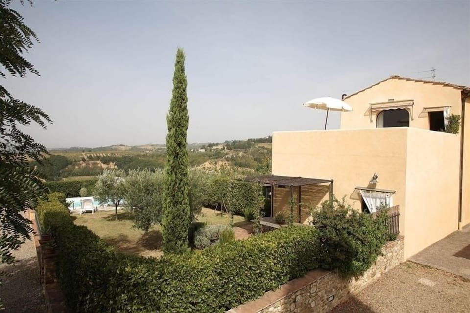 The Villa from outside with private garden and pool