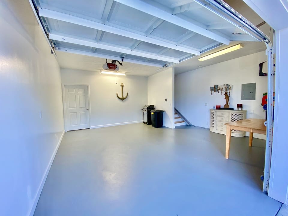 2 Car Garage.  Entrance to Downstairs Apartment and Stairwell to Upstairs Townhome